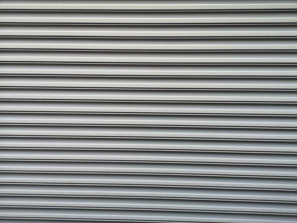 Detailed metallic roller shutter texture ideal for industrial themes.