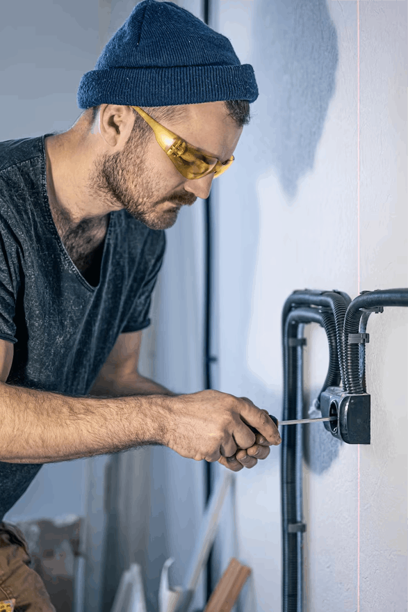 Man working on plumbing fixture